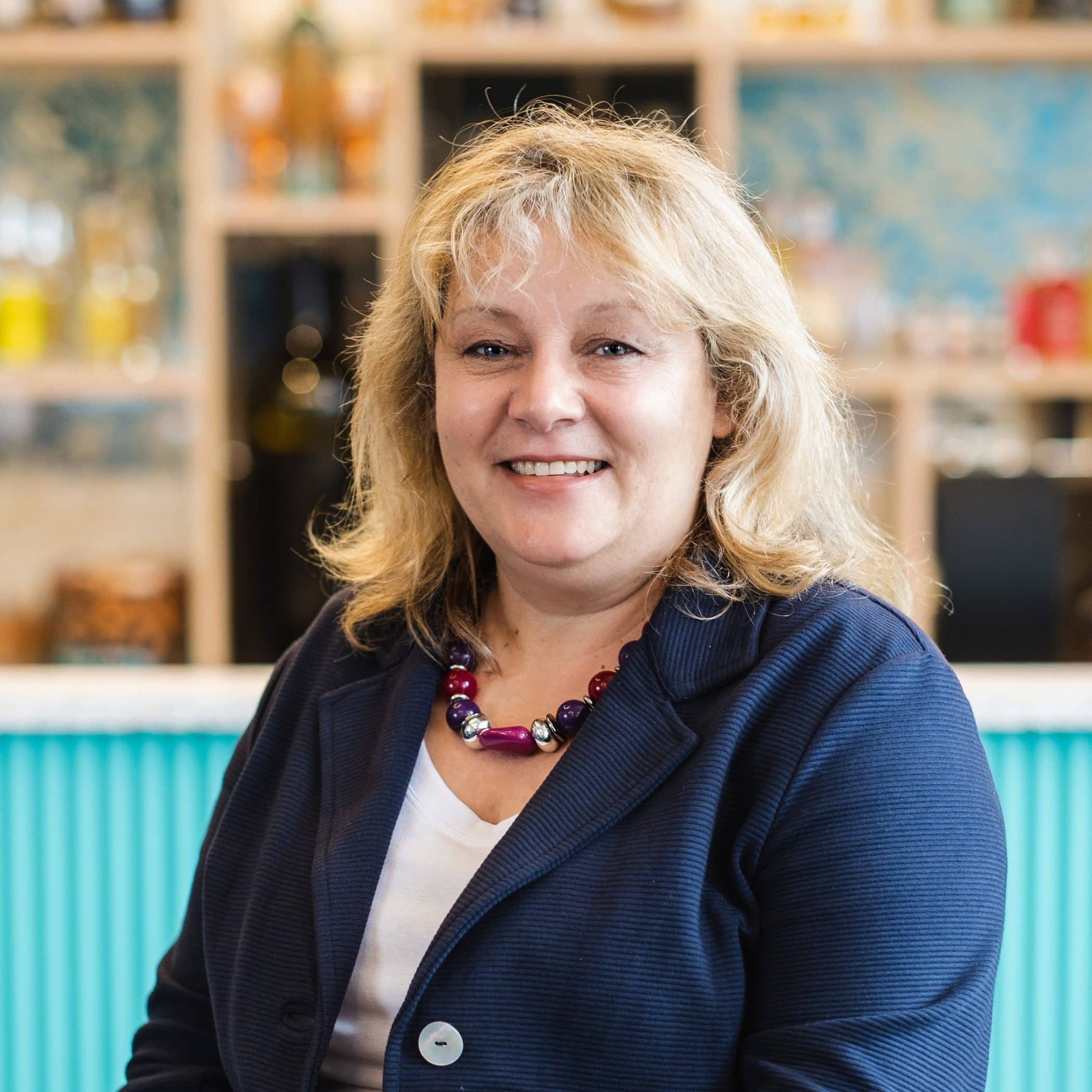 Sue Barnes in front of the Croxsons bar